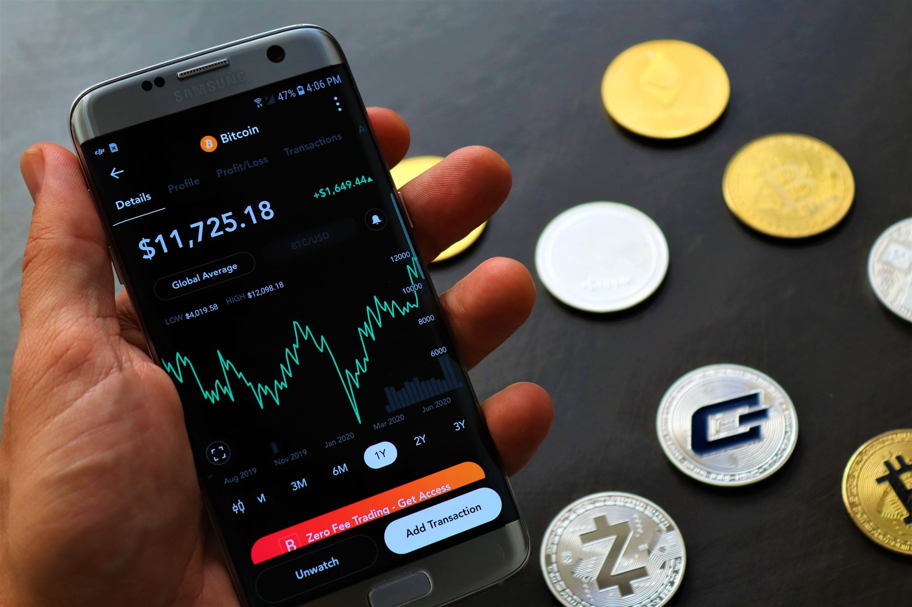Person holding smartphone displaying a cryptocurrency wallet interface