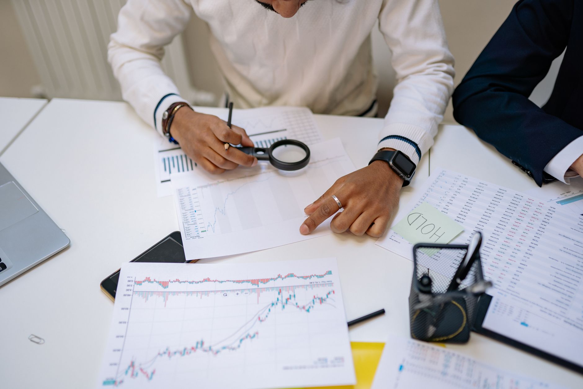 Financial analyst reviewing regulatory documents at a desk