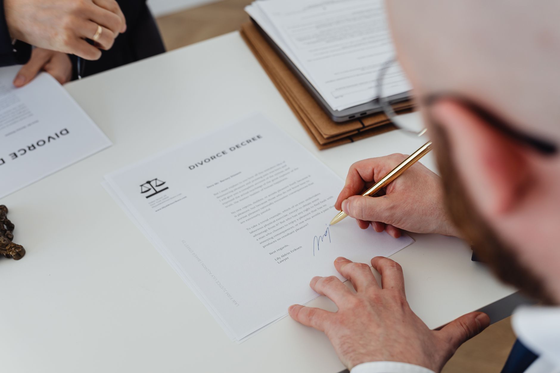 Legal documents spread on a table representing court filings