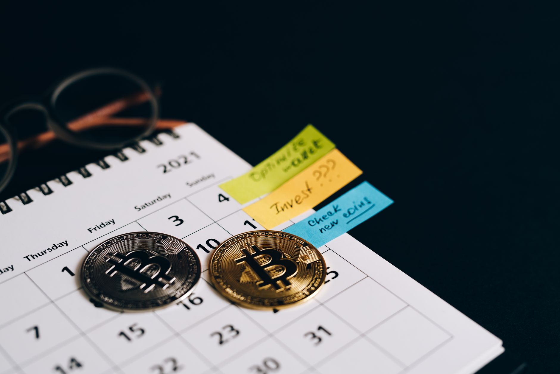 Cryptocurrency tokens on a desk representing digital asset tax considerations
