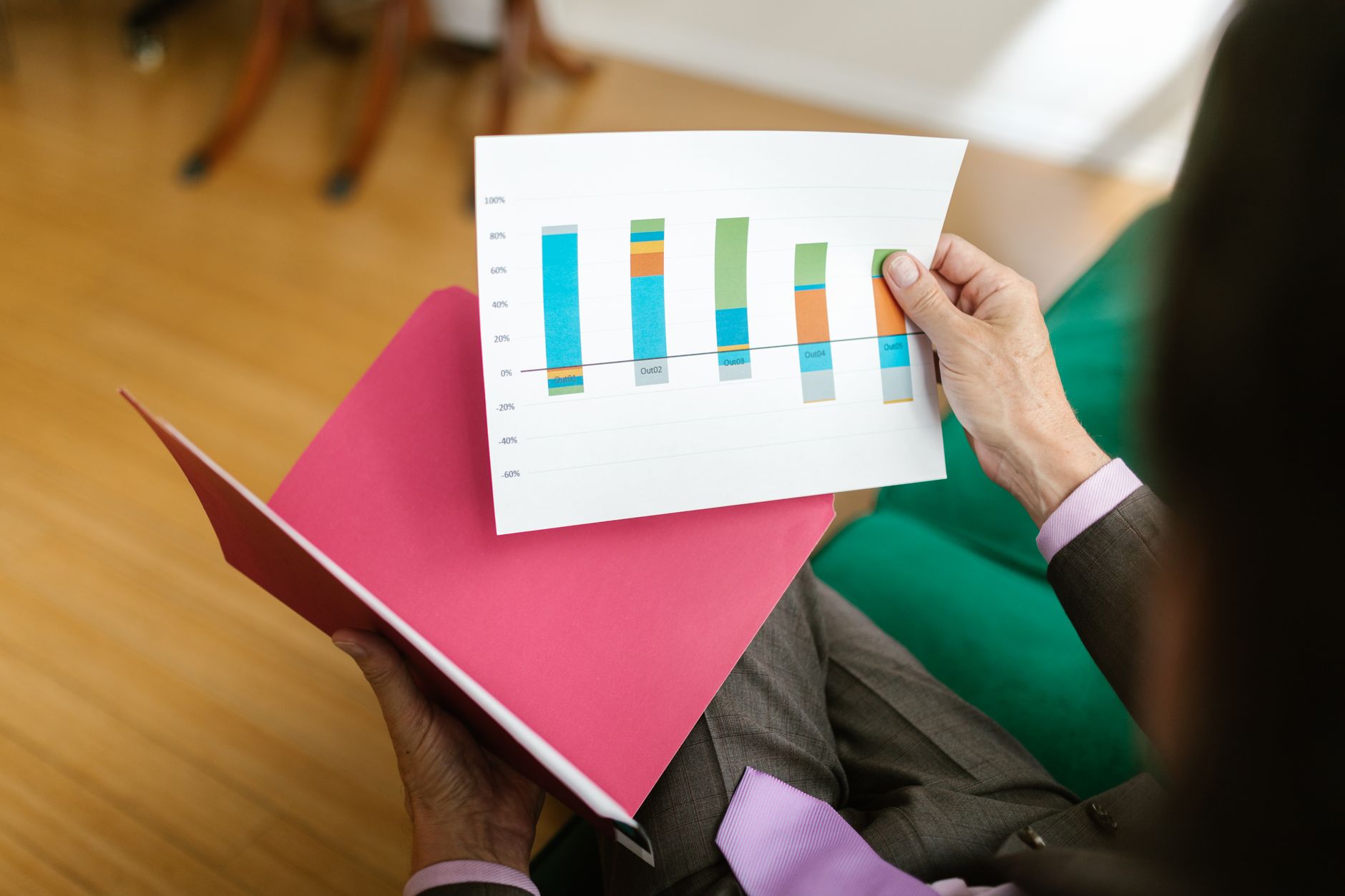 Financial analyst reviewing investment portfolio data on a laptop
