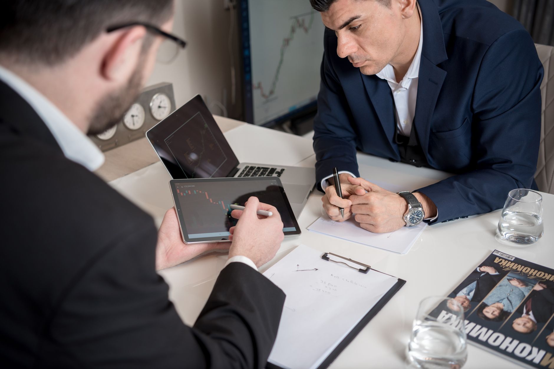Two professionals reviewing financial investment decisions together