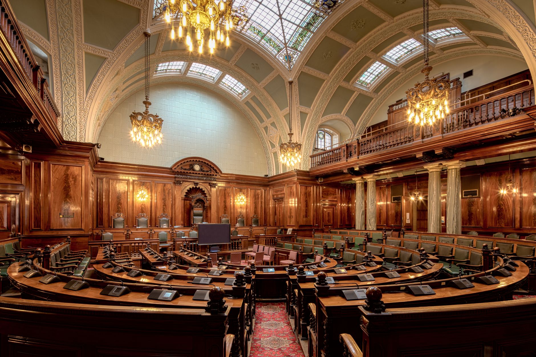 People in a formal discussion setting representing crypto governance debate