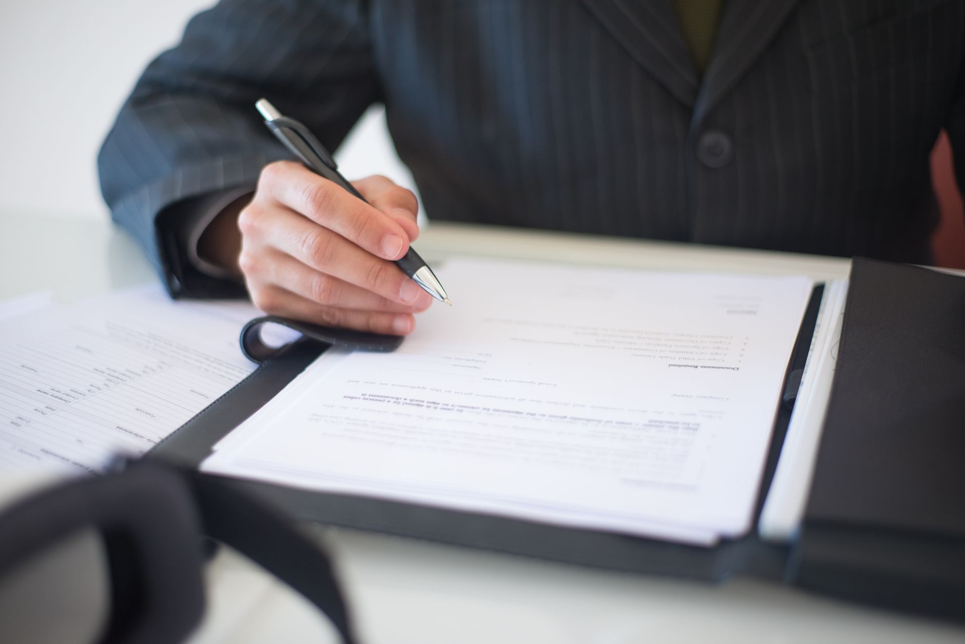Legal documents and contract papers representing DeFi liability and disclosure questions