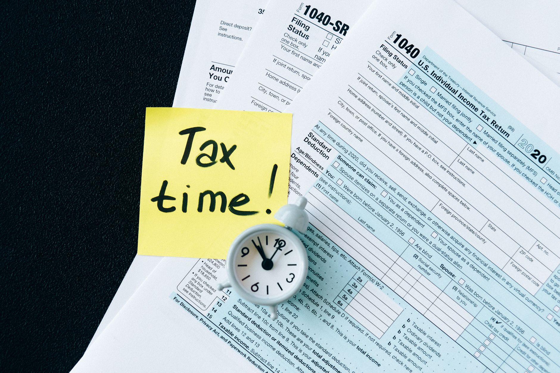 Tax documents and paperwork representing crypto tax reporting requirements under review