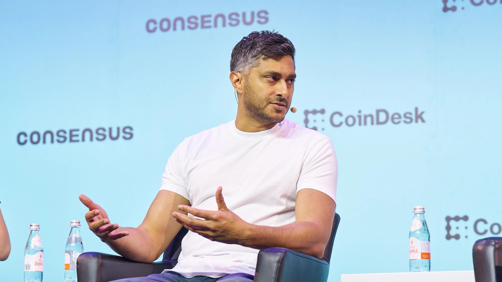 Trader monitoring cryptocurrency perpetual futures on digital screens